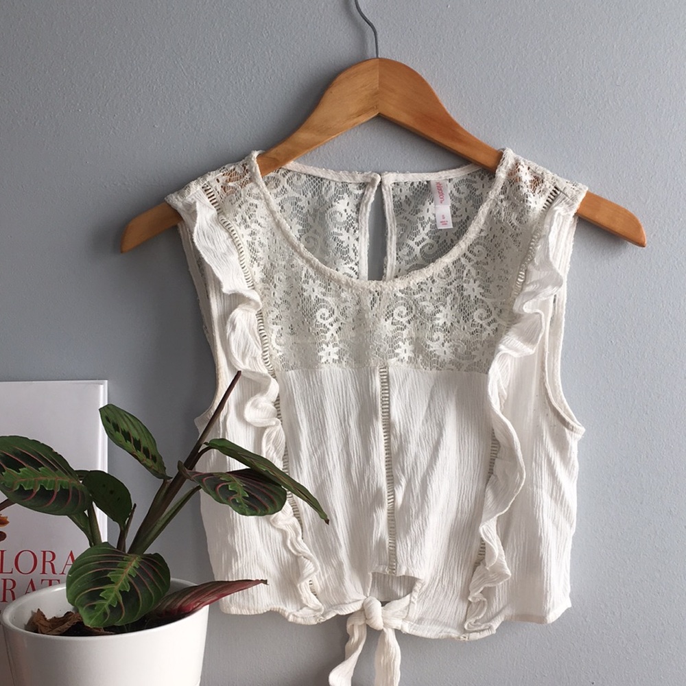 White ruffle sleeveless blouse